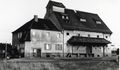 1991:  Das Lagerhaus der <!--LINK'" 0:148--> mit Sicht von der Straße <!--LINK'" 0:149--> aus. Wurde 1998 abgerissen, heute Brachfläche. Rechts am Gebäude der Bahnübergang nach Steinach.