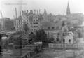 Aufnahme aus der Südstadt nach dem Luftangriff vom 8. auf 9. März 1943 - in der Bildmitte zentral ,  und Nr. 24, <a class="mw-selflink selflink">Kirche St. Paul</a> im Hintergrund