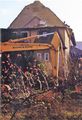1998: Das große Lagerhaus der  am Bahnübergang nach Steinach und Bahnhof Vach wird abgerissen. Blick auf den Wohnungsbereich von der Laderampe aus.