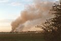 Rauchwolke über Stadeln von <!--LINK'" 0:8--> aus von der brennenden Werkhalle der Firma BIG in Stadeln, April 1998. Bildmitte der Kirchturm der <!--LINK'" 0:9-->.