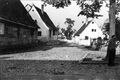 Die Romminggasse von der ehem. Hauptstraße aus gesehen, 1941. Gebäudeteil links <!--LINK'" 0:11-->, Fachwerknebengebäude hinten <!--LINK'" 0:12-->