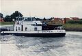 reger Schiffsverkehr auf den <a class="mw-selflink selflink">Main-Donau-Kanal</a> Höhe <!--LINK'" 0:117-->. Im Hintergrund die beiden Kamine der im Bau befindlichen <!--LINK'" 0:118-->, heutiger Standort der Firma <!--LINK'" 0:119--> im August 1996