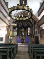 Blick durchs Kirchenschiff in östlicher Richtung des Altarraums der <a class="mw-selflink selflink">Kirche St. Michael</a>
