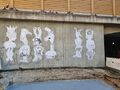 Paste-up Streetart von Sascha Banck am Nordportal der Schwabacher Unterführung. Teil des Kunstprojekts "Frei Luft Galerie". Im Vordergrund ist der vorbereitete Untergrund für das Aufstellen einer Trafostation der infra fürth erkennbar. März 2021
