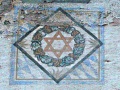 Detail der Fassadenmalerei: Emblem der <!--LINK'" 0:4-->, ca. 1920er Jahre.