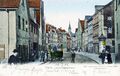 Kolorierte Ansichtskarte mit Blick in die Königstraße, ebenfalls im Bild die Straßenbahn und eine Litfaßsäule, gel. 1906